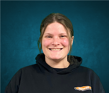 Girl in front of blue background
