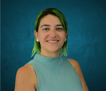 Woman in front of tan background