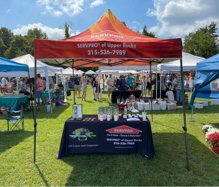 SERVPRO tent above a table set up with giveaway items