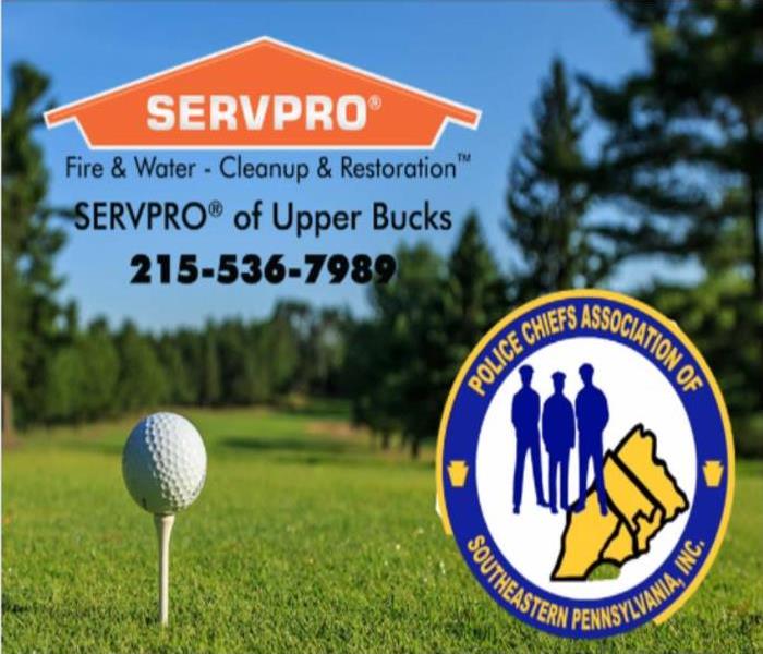 A picture of a golf ball teed up with the SERVPRO logo and Police Chiefs Association of Southeastern PA logo