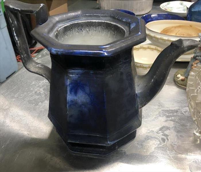 Soot covered tea pot